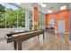 The game room features floor to ceiling windows and a shuffleboard table at 840 United Se Ave # 205, Atlanta, GA 30312