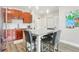 Well-lit kitchen has stainless appliances, granite counters, and island with seating at 840 United Se Ave # 205, Atlanta, GA 30312