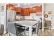 Stylish kitchen showcasing cherry cabinets, granite counters, and stainless steel appliances at 840 United Se Ave # 205, Atlanta, GA 30312