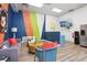 Residents' lounge has modern furnishings, colorful decor, and a refreshment station with a refrigerator at 840 United Se Ave # 205, Atlanta, GA 30312