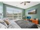Bright main bedroom featuring lots of natural light, work space, and wooden-look floors at 840 United Se Ave # 205, Atlanta, GA 30312