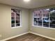 Cozy bedroom featuring new laminate floors and dual windows at 1148 Briarcliff Ne Rd # 1, Atlanta, GA 30306