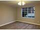 Bedroom with a large window overlooking the backyard and new laminate floors at 1148 Briarcliff Ne Rd # 1, Atlanta, GA 30306