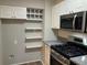 Well-appointed kitchen with stainless steel appliances, granite counters and custom storage at 1148 Briarcliff Ne Rd # 1, Atlanta, GA 30306