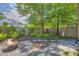 Backyard features mature trees, professional landscaping, stone patio, and a built-in fire pit at 183 Cleveland # B, Atlanta, GA 30316