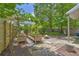 Landscaped backyard with a pergola, raised garden beds, stone patio, and built-in fire pit at 183 Cleveland # B, Atlanta, GA 30316
