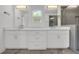 Bright bathroom with marble floors, double sink vanity and walk-in shower with gray tile at 183 Cleveland # B, Atlanta, GA 30316