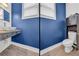 This well-lit powder room features a modern vessel sink, sleek faucet, floating wood counter, and wood-look vinyl floors at 183 Cleveland # B, Atlanta, GA 30316