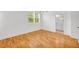 A bright and spacious bedroom with wood floors, a large window, and ensuite bathroom access at 183 Cleveland # B, Atlanta, GA 30316