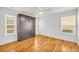 Bright bedroom with a sleek murphy bed, wood floors, and natural light from two windows at 183 Cleveland # B, Atlanta, GA 30316
