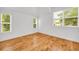 A naturally well-lit bedroom featuring beautiful hardwood floors and large windows at 183 Cleveland # B, Atlanta, GA 30316
