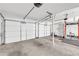 Three car garage with white doors, high ceilings, and weight lifting equipment at 183 Cleveland # B, Atlanta, GA 30316
