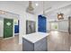 The Kitchen features white cabinets, stainless steel appliances, gray island, and dining space at 183 Cleveland # B, Atlanta, GA 30316