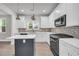 Updated kitchen features white cabinets, stainless steel appliances and a gray kitchen island at 183 Cleveland # B, Atlanta, GA 30316