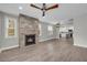 Spacious living room featuring modern lighting, a fireplace and an open layout with the kitchen at 183 Cleveland # B, Atlanta, GA 30316