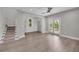 Spacious living room with hardwood floors, staircase and sliding glass doors to the backyard at 183 Cleveland # B, Atlanta, GA 30316