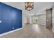 Spacious living room features hardwood floors, blue accent wall, and natural lighting at 183 Cleveland # B, Atlanta, GA 30316