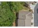 An aerial view of townhome roofs and surrounding mature trees at 2567 Willow Field Se Xing # 22, Marietta, GA 30067