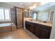 Primary bathroom features soaking tub, shower with glass enclosure, and granite countertops at 2567 Willow Field Se Xing # 22, Marietta, GA 30067