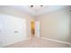 Bedroom featuring neutral paint and carpet, walk-in closet, and attached bath at 2567 Willow Field Se Xing # 22, Marietta, GA 30067