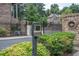 Entry gate callbox with well-maintained landscaping in front of community at 2567 Willow Field Se Xing # 22, Marietta, GA 30067