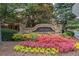 The Oaks townhome community stone entrance sign with colorful landscaping at 2567 Willow Field Se Xing # 22, Marietta, GA 30067