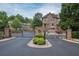 Gated entrance to community, featuring stone pillars and a decorative emblem at 2567 Willow Field Se Xing # 22, Marietta, GA 30067