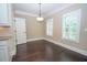 Traditional dining room featuring hardwood floors, chair rail, modern lighting and plantation shutters at 2567 Willow Field Se Xing # 22, Marietta, GA 30067