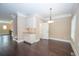 Traditional dining room featuring hardwood floors, chair rail, modern lighting and built-in cabinets at 2567 Willow Field Se Xing # 22, Marietta, GA 30067