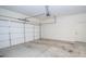 An empty attached garage with an automatic garage door at 2567 Willow Field Se Xing # 22, Marietta, GA 30067
