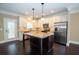 Modern kitchen with stainless steel appliances, granite countertops, and an island with pendant lighting at 2567 Willow Field Se Xing # 22, Marietta, GA 30067