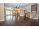 Open living area with hardwood floors, staircase, fireplace, and view into the kitchen at 2567 Willow Field Se Xing # 22, Marietta, GA 30067