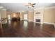 Open-concept living room with fireplace, hardwood floors, and adjacent kitchen, perfect for entertaining at 2567 Willow Field Se Xing # 22, Marietta, GA 30067