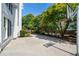 Spacious backyard featuring a basketball hoop, lush landscaping, a concrete patio, and mature trees at 2956 Nestle Creek Dr, Marietta, GA 30062