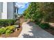 Beautiful backyard featuring walkway, lush greenery, tasteful landscaping, and outdoor firepit at 2956 Nestle Creek Dr, Marietta, GA 30062