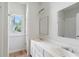 A bright bathroom featuring double sinks and a large mirror offers a well-lit space with modern fixtures at 2956 Nestle Creek Dr, Marietta, GA 30062