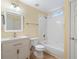 Well-lit bathroom with white tiled shower-tub and sink with modern faucet at 2956 Nestle Creek Dr, Marietta, GA 30062