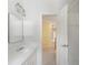 A well-lit bathroom with double sinks and a separate bath area create a functional and bright space at 2956 Nestle Creek Dr, Marietta, GA 30062