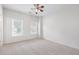 Minimalist bedroom with neutral carpet, white walls, and bright natural light at 2956 Nestle Creek Dr, Marietta, GA 30062