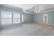 Large bedroom with lots of natural light, neutral paint and carpet, and tray ceilings at 2956 Nestle Creek Dr, Marietta, GA 30062