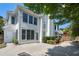 The backyard of the two-story home with large windows and white siding offers an appealing outdoor space at 2956 Nestle Creek Dr, Marietta, GA 30062