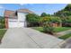 Charming two-story home with a two-car garage, well-maintained lawn, and a long driveway at 2956 Nestle Creek Dr, Marietta, GA 30062