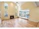 Inviting living room with hardwood floors, fireplace, and large windows providing natural light at 2956 Nestle Creek Dr, Marietta, GA 30062