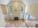 Spacious living room featuring soaring ceilings, large windows, and a cozy fireplace at 2956 Nestle Creek Dr, Marietta, GA 30062