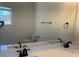 Bathroom with a large mirror, double sinks, and modern faucets at 5099 Noble Village Way, Lilburn, GA 30047