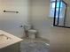 Clean bathroom features a shower, toilet, and sink with a spacious vanity at 5099 Noble Village Way, Lilburn, GA 30047
