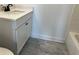 Modern bathroom with single sink and white cabinets in the vanity at 5099 Noble Village Way, Lilburn, GA 30047