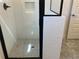 Modern shower with subway tile and glass door in the bathroom at 5099 Noble Village Way, Lilburn, GA 30047