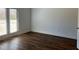 Bedroom with hardwood floors and private door to the outside space at 5099 Noble Village Way, Lilburn, GA 30047