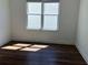 Bedroom with hardwood floors and window for natural light at 5099 Noble Village Way, Lilburn, GA 30047
